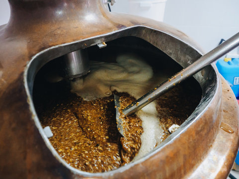 Brew of craft beer at vat in brewery