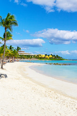 White sand beach and waves on the coast of  Mexico