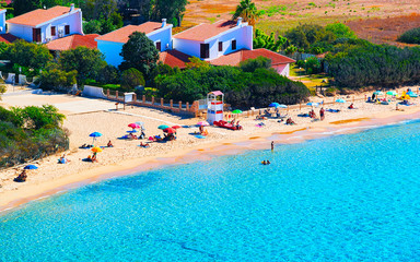Obraz premium Landscape of Chia Beach and Blue Waters of the Mediterranean Sea in Province of Cagliari in South Sardinia in Italy. Scenery and nature. Mixed media.