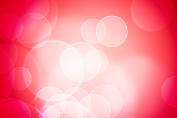 Defocused lights over red background