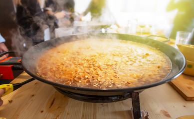 Paella pan with traditional Spanish food usually prepared with rice, meat, seafood