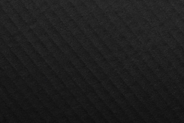 Fototapeta premium The surface of black paper texture, craft paper cardboard for a background close up