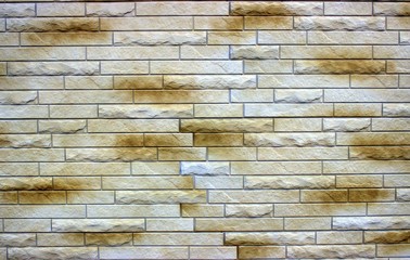 Fototapety   Masonry of smooth and embossed bricks of brown color. Nice background for shooting