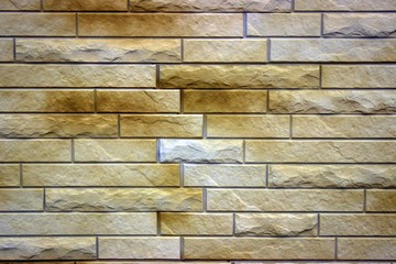  Embossed masonry brick in light brown with dark spots