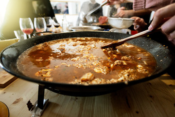 Paella pan with traditional Spanish food usually prepared with rice, meat, seafood