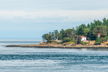 Naklejka premium View over inlet, ocean and island with boat and mountains in beautiful British Columbia. Canada.