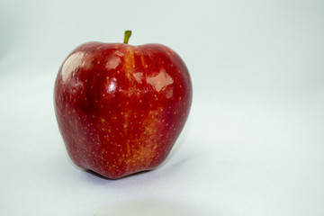 red apple on white background, place for text