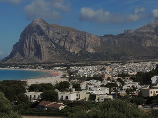 San Vito lo Capo &ndash; panorama of the white town, the turquoise sea, the white beach and the rocky peak in the background