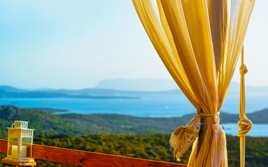 Sunrise or sunset at Cafe or Restaurant veranda near Porto Rotondo on at Mediterranean sea in...