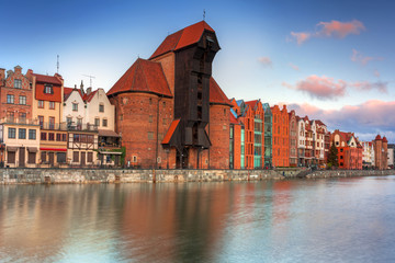Naklejka premium Beautiful scenery of the old town in Gdansk over Motlawa river at sunrise, Poland.
