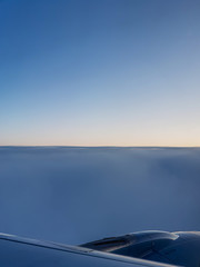 stunning beautiful sunrise in flight with engine and wing on foreground