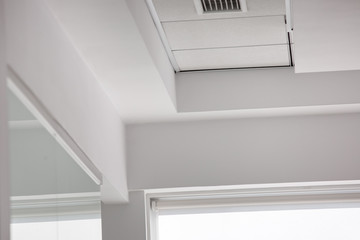 multi-level ceiling with three-dimensional protrusions and a suspended tiled ceiling with roller...