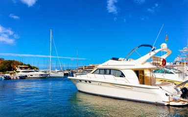 Fototapeta premium Scenery with Marina and luxury yachts at Mediterranean Sea of Porto Cervo in Sardinia Island of Italy in summer. Landscape View on Sardinian town port with ships and boats in Sardegna. Mixed media.