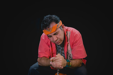 Shaman man, sorcerer, giving thanks duringPre-Hispanic ritual in Healing and cleaning with...
