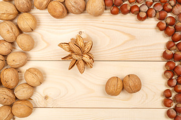 Frame of nuts on a background of wooden boards