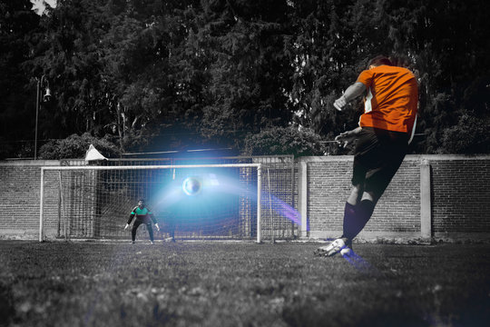 the Goal keeper waiting for the ball in a game of football (soccer), ball path marked with neon blue line