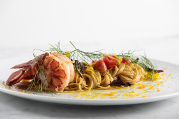 Housemade lobster pasta with cherry tomatos, garlic, dill and lemon zest