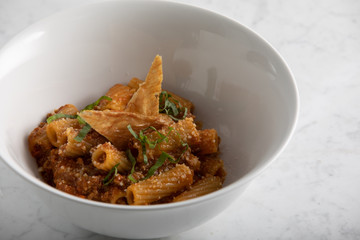 Homemade rigatoni pasta with classic bolognese sauce