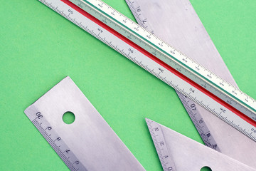 Rulers and tools on green background