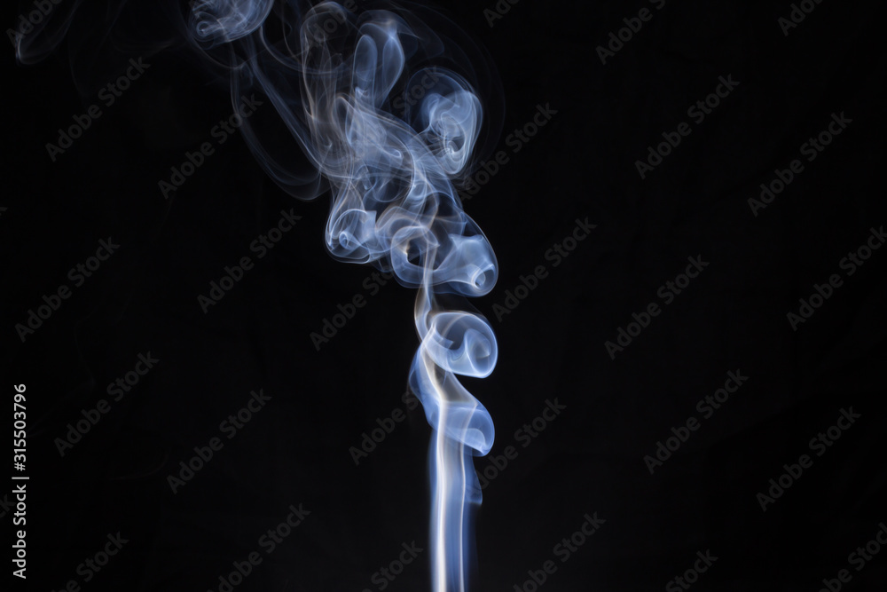 Wall mural abstract smoke isolated on dark background