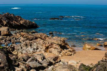 Fototapeta na wymiar Sunny day at the beautiful coastline and beaches at Porto city in Portugal