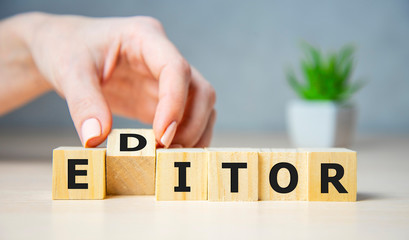 Editor concept. Wooden letters on the office desk, informative and communication background