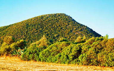 Landscape and Beautiful Scenery with mountains in Teulada, Carbonia-Iglesias. Panorama in South Sardinia island of Italy. Sardegna in summer. Cagliari province. Mixed media.
