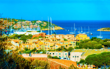 Scenery with Marina and luxury yachts at Mediterranean Sea of Porto Cervo in Sardinia Island of Italy in summer. Landscape View on Sardinian town port with ships and boats in Sardegna. Mixed media.