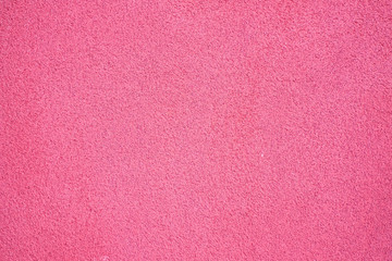 Empty rough pink background texture, material for graphic design use in backdrops and banners.