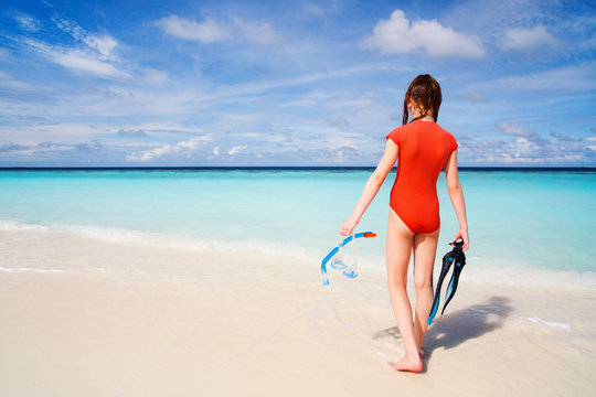 Adorable teenage girl at beach