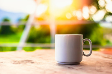 A cup of coffee on the table in the morning.