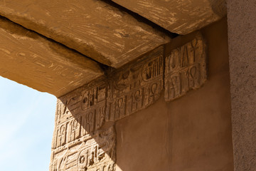 Karnak Temple, complex of Amun-Re. Embossed hieroglyphics on walls. Luxor Governorate, Egypt. Ankh is an ancient Egyptian hieroglyphic symbol that means the word 