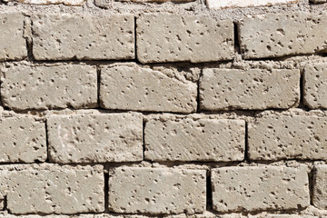 Wall with rough brickwork. Bedouin house wall in african desert.
