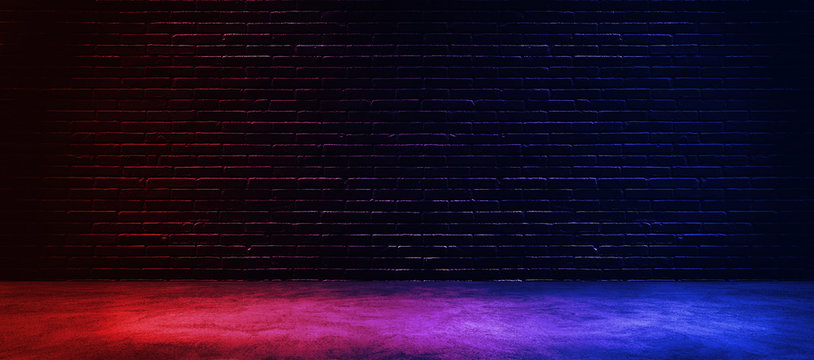 Studio dark room with lighting effect red and blue on black brick wall gradient background for interior decoration.