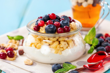 Yogurt with cereal and berries. Selective focus. Copy space