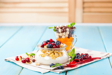 Yogurt with cereal and berries. Selective focus. Copy space