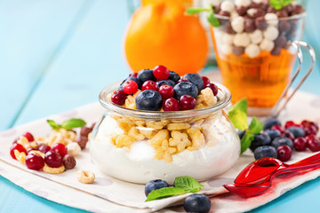 Yogurt with cereal and berries. Selective focus. Copy space