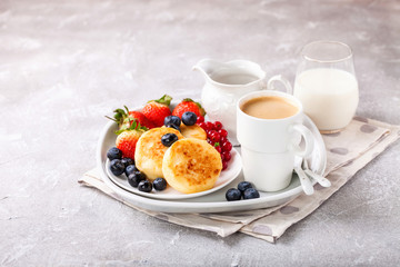 Cottage cheese pancakes with berries. Selective focus. Russian cheesecakes. Copy space