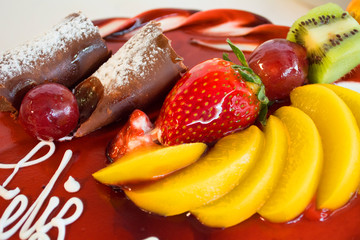 Chocolate cake covered with fruits