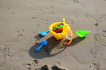 Fototapeta na wymiar plastic toys on the beach