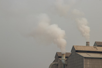 Industrial plants release pollutants into the atmosphere.