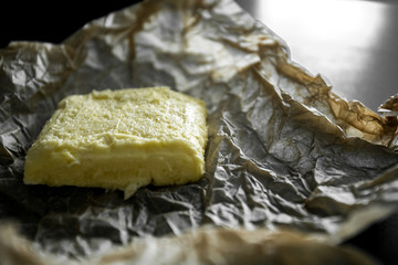 soft butter on wrapper and black table