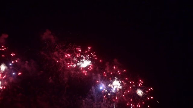 Beautiful abstract colourful Fireworks explode display on sky at night a symbol of celebration in New years anniversary for background