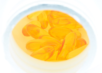 yellow vitamin e fish oil capsule in bottled
