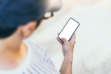 Mockup image blank white screen cell phone.man hand holding texting using mobile.background empty space for advertise text.people contact marketing business,technology 