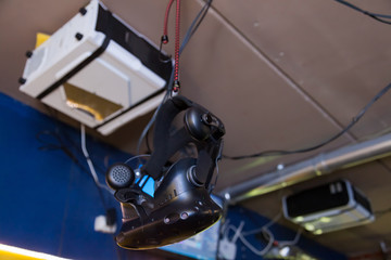 Black helmet mask for immersion in virtual reality with 3D image in games and simulators with increased sensitivity. Modern technologies in computer games and entertainment. Cyberspace and virtuality.