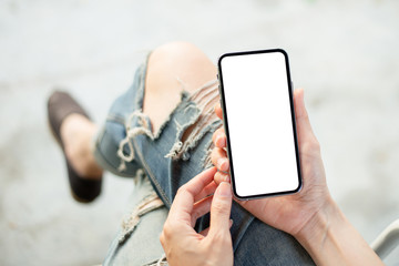 Mockup image blank white screen cell phone.woman hand holding texting using mobile.background empty space for advertise text.people contact marketing business,technology 