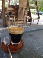 cup of coffee on wooden table in cafe
