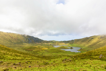 The sun begins to move into the Corvo Crater on a summer day on the island of Corvo in the Azores, Portugal.