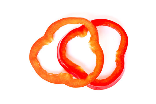 Slices of red bell pepper isolated on white background.